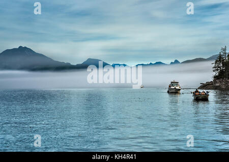 Fishing boats, foggy day in Johnstone Strait off Vancouver Island, British Columbia, Canada Stock Photo