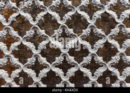 Vintage metal openwork grille in gray, abstract background Stock Photo