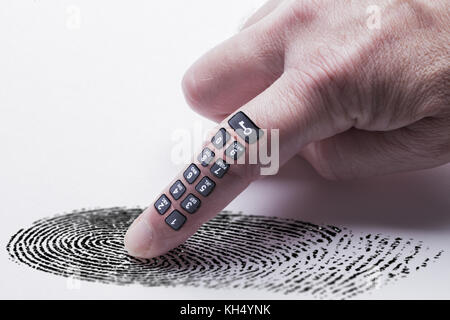 Digital finger print concept for online identity protection showing a finger with a keypad pressing on a finger print mark. White background Stock Photo