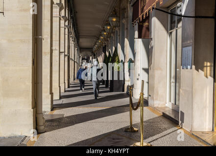 Paris, France -- November 7, 2017--  People walking by the shops, restaurants and hotels on the Rue de Rivoli in Paris. Editorial Use Only. Stock Photo