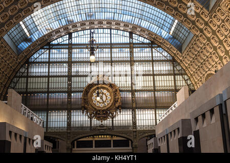 Paris, France -- November 7, 2017 -- An ornate clock hangs on the wall. Stock Photo