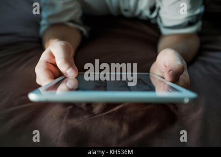 close up hands of caucasianman using tablet, connecting wifi. Up view. Stock Photo