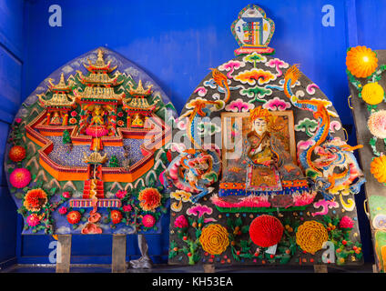 Tibetan buddhist sculptures made by monks from coloured butter in Labrang monastery, Gansu province, Labrang, China Stock Photo