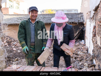 House being renovated by chinese workers in conservation area, Gansu province, Linxia, China Stock Photo