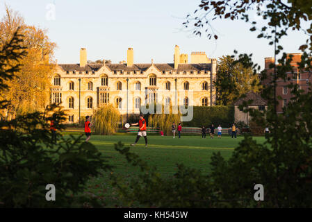 Students on Trinity College playing fields, Cambridge University, England, UK.