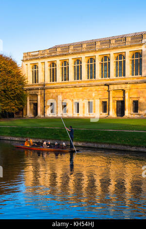 Scenic view of the Wren Library at sunset, Trinity College, Cambridge University; with punting in front on the river Cam, UK. Stock Photo