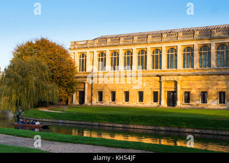 Scenic view of the Wren Library at sunset, Trinity College, Cambridge University; with punting in front on the river Cam, UK. Stock Photo