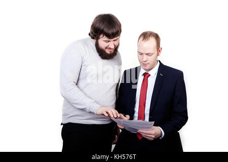senior and junior businessman discuss and argue over something during their meeting, younger one sign contract or some documents, isolated on white Stock Photo