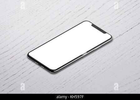 Smart phone with isolated x smart phone screen in isometric side position on white wooden table. Stock Photo