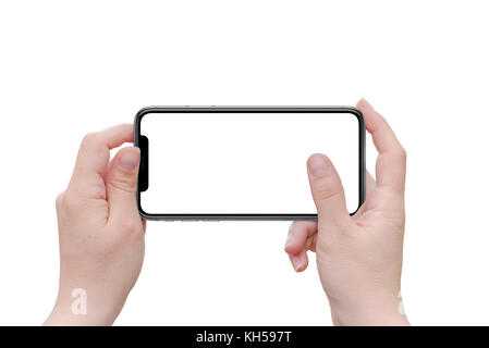 Isolated black curved x mobile phone in horizontal position in woman hands. Stock Photo