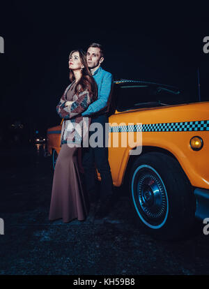 Couple Poses With Gray Cabriolet. - Stock Video | Motion Array