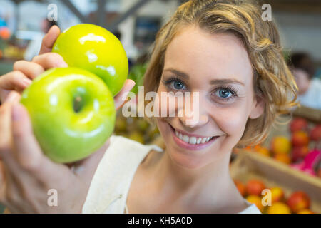 girl holding green apples Stock Photo
