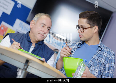 2 workers having lunchbreak Stock Photo