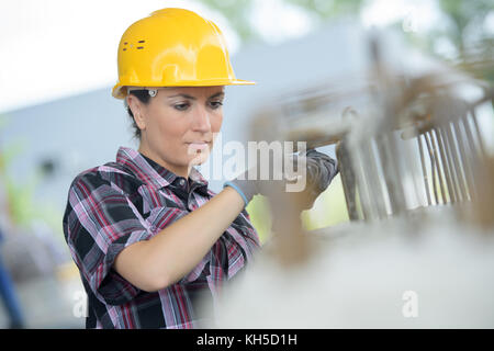 woman engineer wearing protective workwear - outdoor Stock Photo
