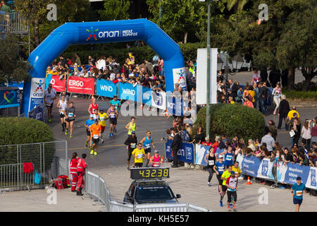 Athens, Greece - November 12, 2017: Marathon runners entering the Panathenaic stadium for the finishing line, during the 35th Athens Authentic Maratho Stock Photo