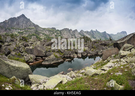Mirror reflections in Lake Harmony in the high mountains of Ergaki, Russia. Stock Photo