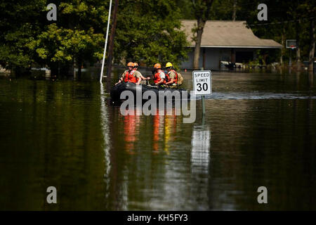 Texas National Guard Soldiers with the 551st Multi-Role Bridge Company out of El Campo, Texas search for flooded neighborhoods in Orange, Texas to patrol with their boats, Sept. 4, 2017. Hurricane Harvey formed in the Gulf of Mexico and made landfall in southeastern Texas, bringing record flooding and destruction to the region. (U.S. Air Force photo by Master Sgt. Joshua L. DeMotts) Stock Photo