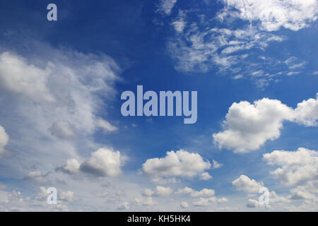 Beautiful clouds in the dark blue sky. Heavenly background. Stock Photo