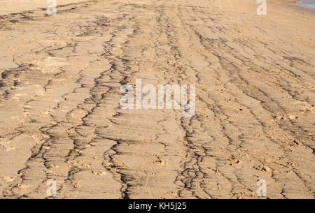 Pattern made by coal dust on the beach at Newbiggin by the sea, Northumberland, England, UK Stock Photo