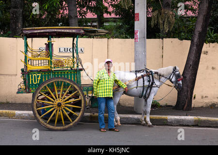 Horse carriage is popular for tourists in the streets of old Manila, Philippines Stock Photo