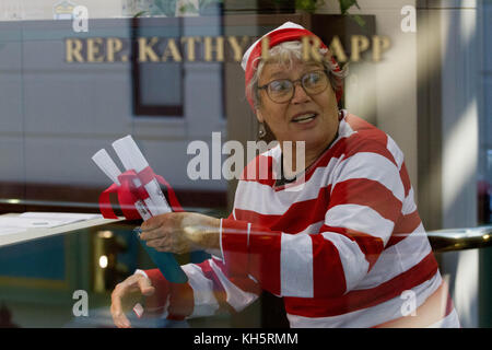 Philadelphia, Pennsylvania, USA. 13th November, 2017.  A demonstrator dressed as the book character Waldo makes a point about the Pennsylvania legislature not holding session, Monday, November 13, 2017. Credit: Michael Candelori/Alamy Live News Stock Photo