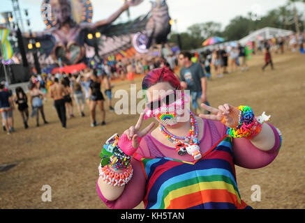 Orlando, United States. 11th Nov, 2017. A woman wearing a face mask, necklaces, and bracelets, all made with beads, poses at the Electric Daisy Carnival, the largest electronic dance music festival in the United States, on November 11, 2017 at Tinker Field in Orlando, Florida. The two-day rave drew over 80,000 people with police reporting only five arrests. Credit: Paul Hennessy/Alamy Live News Stock Photo