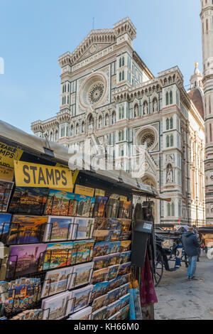 Florence, Italy - October 31st, 2017: Souvenirs for sale in front of Florence's iconic Cattedrale di Santa Maria del Fiore Stock Photo