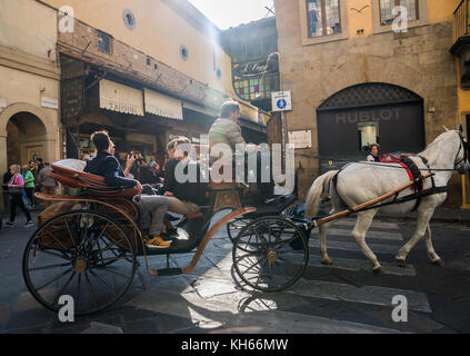 Horse-drawn carriage on Ponte Vecchio, Florence, Italy Stock Photo