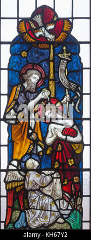 LONDON, GREAT BRITAIN - SEPTEMBER 19, 2017: The Baptism of Christ on the stained glass in St Mary Abbot's church on Kensington High Street. Stock Photo