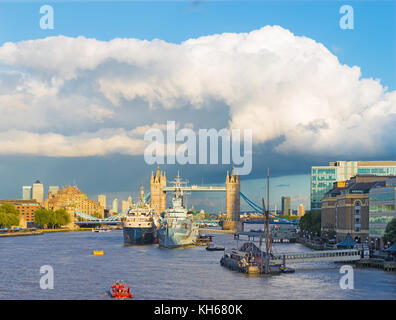 London - The view to the Tower bridge, riverside in evening light with the dramatic clouds. Stock Photo