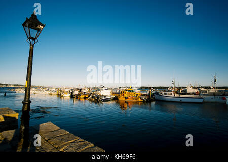 Boats in Poole harbour, Dorset at dusk Stock Photo