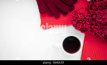 Knitted scarf and hat on the table. Warm clothes for fall and wi Stock Photo
