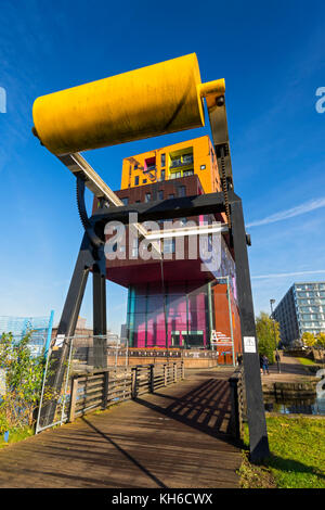 The Chips apartment building, by Will Alsop, and a bascule lifting bridge, by the Ashton Canal, New Islington, Ancoats, Manchester, UK Stock Photo