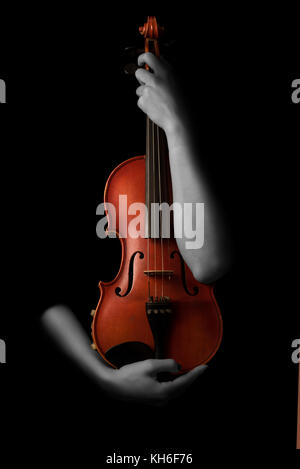 Violin music instrument violinist. Classical player hands. Details of violin playing isolated on black Stock Photo