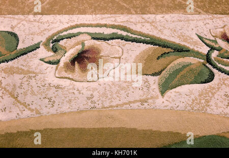 Background image: section of carpet with a picture of a flower. Stock Photo