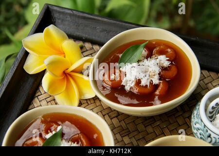 Jaja Batun Bedil, Balinese traditional snack of glutinous rice balls in palm sugar soup Stock Photo