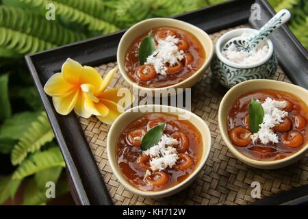 Jaja Batun Bedil, Balinese traditional snack of glutinous rice balls in palm sugar soup Stock Photo