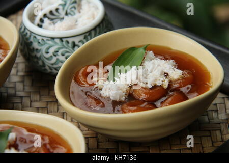 Jaja Batun Bedil, Balinese traditional snack of glutinous rice balls in palm sugar soup Stock Photo