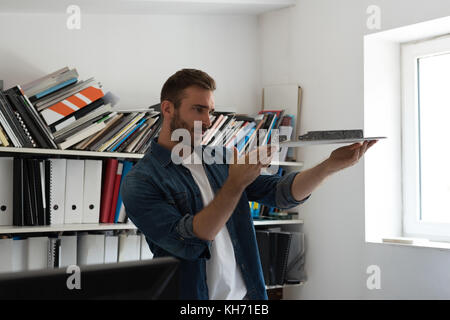 Handsome male architect working in the office Stock Photo
