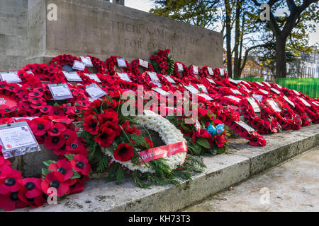 Red poppy wreaths laid during Remembrance Day commemoration at Southampton Cenotaph in November 2017, Hampshire, UK Stock Photo