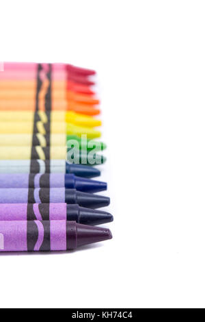 A line of crayons isolated on a white background. Stock Photo