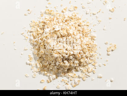 Avena Sativa is scientific name of Oat cereal grain. Also known as Aveia or Avena. Top view of scattered grains. Stock Photo