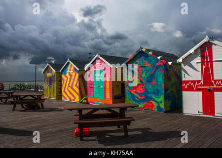 beach huts in the rain Stock Photo