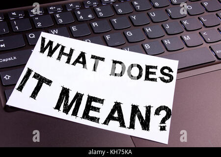 Conceptual hand writing text caption inspiration showing question What Does It Mean. Business concept for question and unknown written on sticky note, reminder cork background with copy space Stock Photo