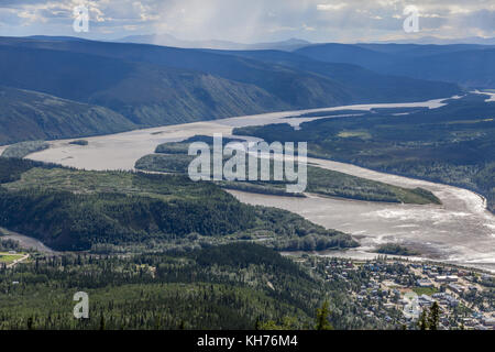 The small Klondike river flows into the Yukon River at Dawson City - a natural site for the location of the 19th Century Gold Rush town of Dawson City Stock Photo