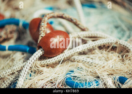 Pile of commercial fishing net with cords and floats Stock Photo by  stevanovicigor