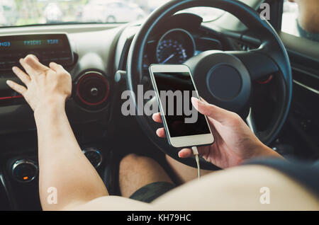 Man using phone in the car. Stock Photo