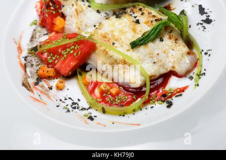 Conger with vegetables and spicy sauce. Stock Photo