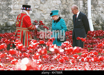 16/10/2014. Queen Elizabeth II and the Duke of Edinburgh visit the Tower of London's Blood Swept Lands and Seas of Red installation. The Royal couple will celebrate their platinum wedding anniversary on November 20. Stock Photo