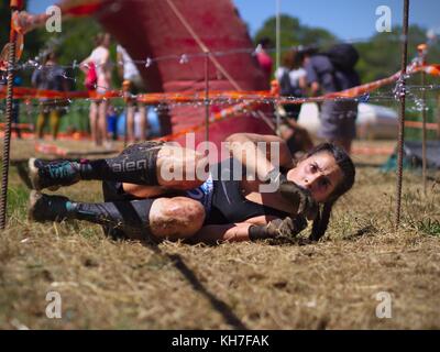 Photos taken in the race Eternal Running 2017 in Pallaresos, Tarragona, Spain.Young athletes females in passing one of the hundreds of obstacles. Stock Photo